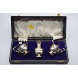 A cased silver three piece condiment set, by William Adams Ltd, Birmingham 1911 & 1921, 102g.