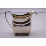 A George III silver milk jug, maker's mark indistinct, London 1807, 10cm high, 183g.