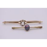 An oval opal bar brooch, stamped 15ct, 5.5cm, 4g; together with another yellow metal bar brooch, set