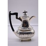 A silver hot water jug, by Walker & Hall, Sheffield 1937, 20cm high, 533.5g total weight.
