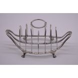 An unusual Edwardian silver combination egg holder and toast rack, by Thomas Bradbury & Sons Ltd,