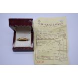 A gold and diamond eternity ring, hallmarked 750, set ten inline brilliant cut diamonds of
