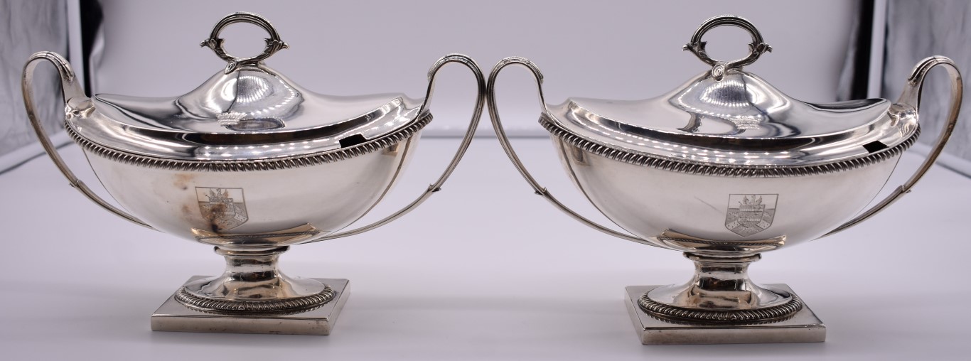 A good pair of George III silver twin handled pedestal sauce tureens and covers, by William Frisbee,