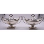 A good pair of George III silver twin handled pedestal sauce tureens and covers, by William Frisbee,