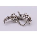 A diamond floral spray brooch, hallmarked 18ct for 1976, set brilliant cut stones of approximately