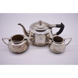 An Art Deco Indian white metal three piece tea set, by P Orr & Sons, Madras, stamped 'ORR 26, Silver