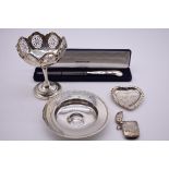 A small collection of silver, to include: an Edwardian pierced sweetmeat dish, by Henry Matthews,