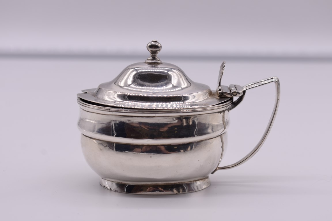 A George III silver mustard, by Charles Fox I, London 1807, 8cm high, 101g.