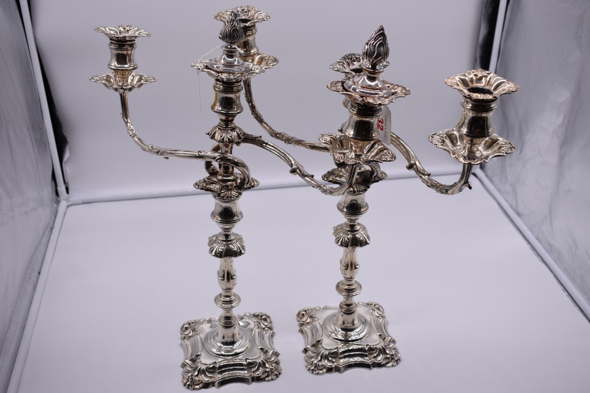 A pair of George IV silver candlesticks by Creswick & Co, Sheffield 1829, having weighted bases