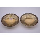 A pair of pierced silver gilt bonbon dishes, by Walker & Hall, Sheffield 1934, 18cm diameter, 546g.