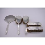 An engine turned silver three piece dressing table set, by S J R London 1956/7; together with a
