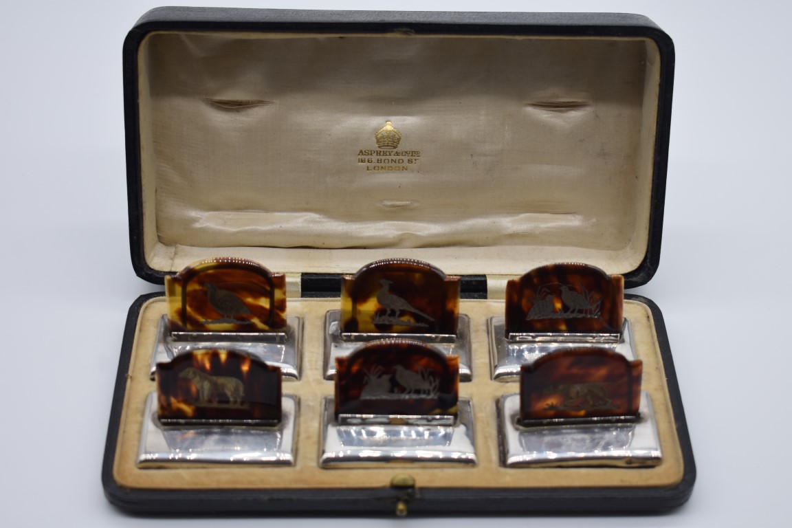 An Asprey & Co Ltd cased set of six silver and tortoiseshell menu holders, by J Batson & Son, London