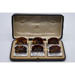An Asprey & Co Ltd cased set of six silver and tortoiseshell menu holders, by J Batson & Son, London