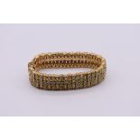 A vintage Ciner gold plated and Swarovski crystal bracelet, 18cm long.