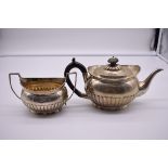 A Victorian silver teapot and sugar bowl, by Charles Stuart Harris, London 1890/2, 784g.