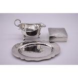 A silver sauce boat, by C W Fletcher & Son Ltd, Sheffield 1925; together with an oval silver dish,