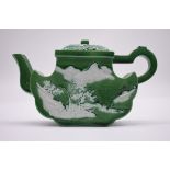 A good Chinese green glazed teapot and cover, circa 1900, in the manner of Wang Bing Rong, finely
