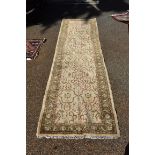 A Persian runner, having floral decoration to central field with floral borders, 302 x 82cm.