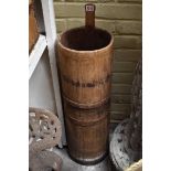 An old staved pine and steel bound churn, 87cm high.