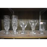 A small group of antique clear glass, comprising a pair of cut celery vases, 19.5cm; two rummers;