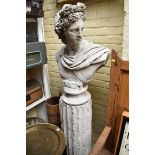 A painted composition stone bust of Apollo, on column base, total height 177cm.