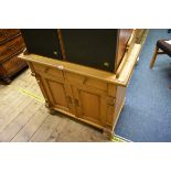 An antique pine side cabinet, 86cm wide.