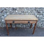 A Victorian mahogany tea table, 76cm wide; together with a rectangular pine table having one long