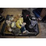 A collection of ten teddy bears, to include, a vintage golden mohair example, with velvet pads; a