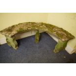 An old weathered composition stone curved garden bench, 154cm wide.