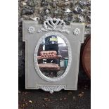 An Andrew Martin hand painted and carved wall mirror, with oval plate, 106 x 81.5cm. This lot can