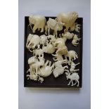 A collection of carved ivory animals, largest 6cm high. (24)