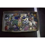 A collection of fifty-seven enamelled racecourse badges, circa 1980s onwards. (57)