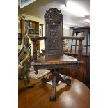 An interesting pair of 19th century continental carved caqueteuse chairs, each on tripod swivel