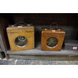 Two old oak cased pigeon clocks.