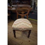 A set of six Victorian balloon back dining chairs.
