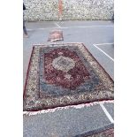 A Persian style carpet, having large central medallion, decorated allover with floral decoration,