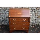 An Edwardian inlaid mahogany bureau, 76.5cm wide. This lot can only be collected on Saturday 5th