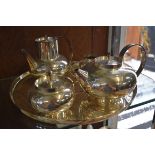 A four piece tea set on tray, by Lino Sabattini, the tray 36cm diameter. (5)