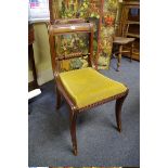 A set of six Regency mahogany sabre leg dining chairs, with ropetwist backs.