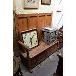 An antique pine panelled box seat settle, with open arms, 137.5cm wide.