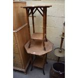 A graduated pair of bamboo and rattan two tier octagonal occasional tables, largest 56cm wide.