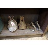 Two old carved wood stirrups; together with another pair of antique bronze stirrups.