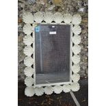 A large mirror with shell design frame, 129 x 91cm. This lot can only be collected on Saturday 5th