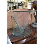 A glass circular low occasional table, 45cm diameter.