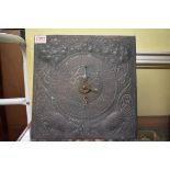 An Arts and Crafts hammered and embossed copper clock dial, possibly Keswick, 27.5cm square, (with