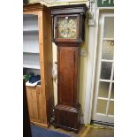 A George III oak and walnut crossbanded eight day longcase clock, the 11in square brass and silvered