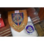 Automobilia: a Royal Military Police car radiator badge; together with a similar painted wooden