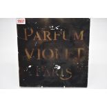 An early 20th century reverse painted glass 'Parfum Violet Paris' sign, 20cm square, (shallow chip