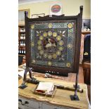 A Victorian stained and leaded glass panel, 54.5 x 56cm, (minor cracks), mounted in a 1920s oak