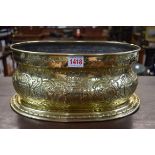 An 18th/19th century Continental embossed brass oval cistern, decorated with the Bruges coat of